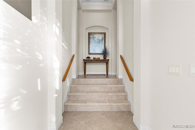 staircase with tile patterned floors