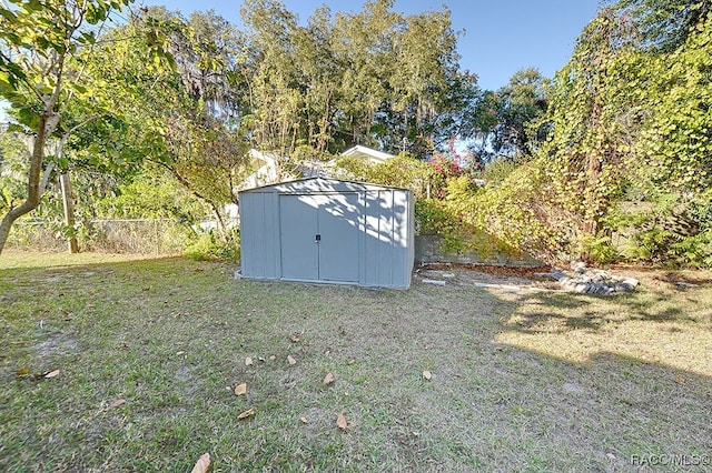 view of outbuilding featuring a yard