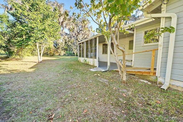 view of yard with a sunroom