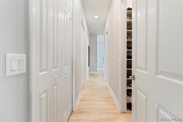 office space featuring light wood-style floors, baseboards, and recessed lighting