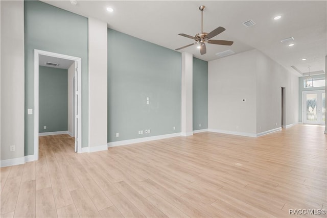 unfurnished living room with light wood-type flooring, baseboards, a ceiling fan, and recessed lighting