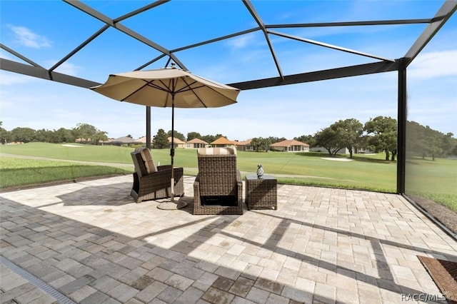 view of patio with glass enclosure