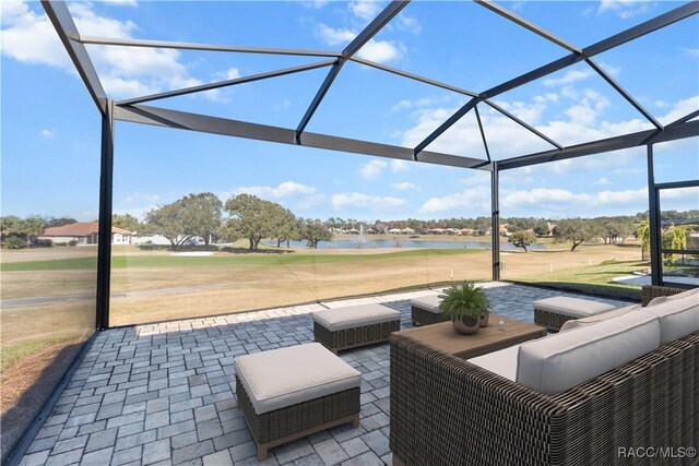 view of property's community featuring a water view and a yard