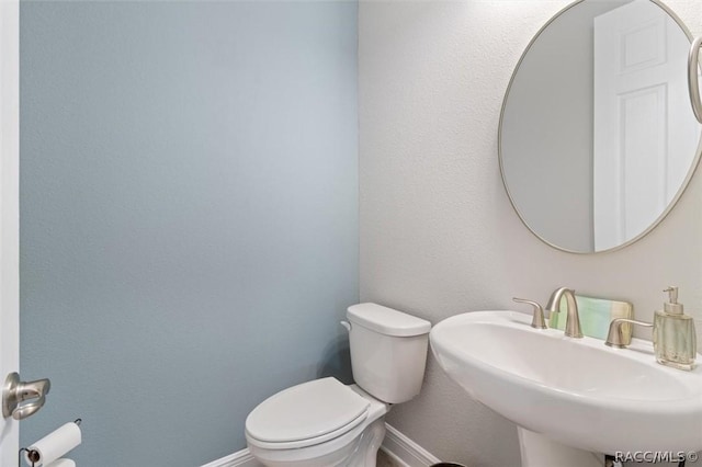 bathroom with sink and toilet