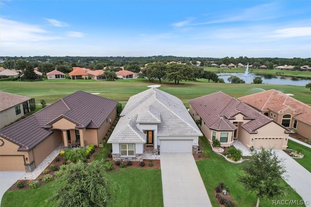 birds eye view of property with a water view and a residential view