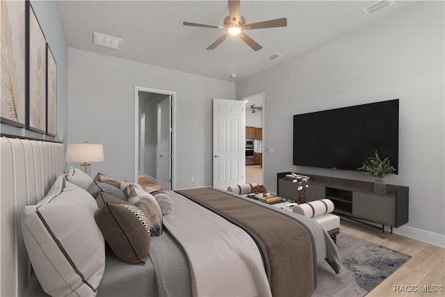 bedroom featuring ceiling fan and light hardwood / wood-style floors