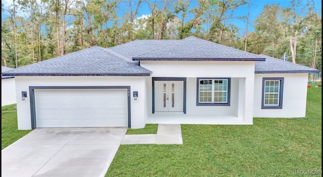 view of front of home with a garage and a front yard