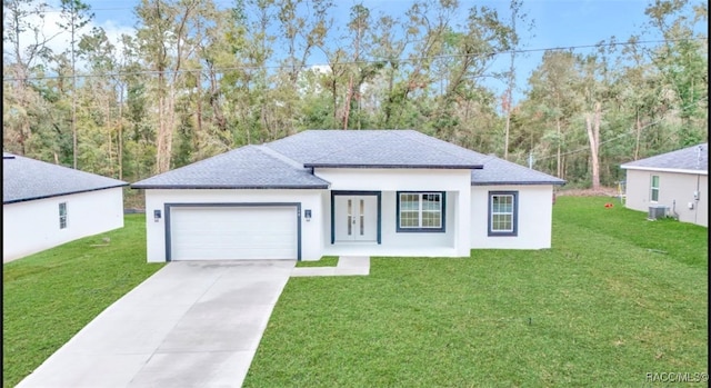 view of front of property featuring a garage and a front yard