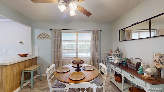 dining space featuring ceiling fan