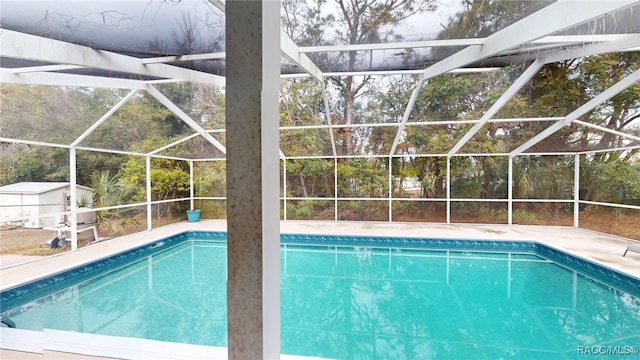 view of pool featuring a lanai and a patio