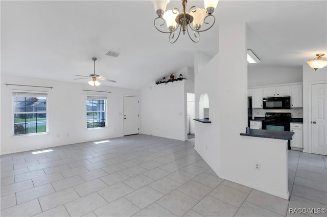 unfurnished living room with light tile patterned floors, ceiling fan with notable chandelier, and lofted ceiling