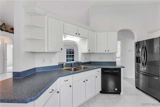 kitchen featuring kitchen peninsula, sink, black appliances, white cabinets, and light tile patterned flooring