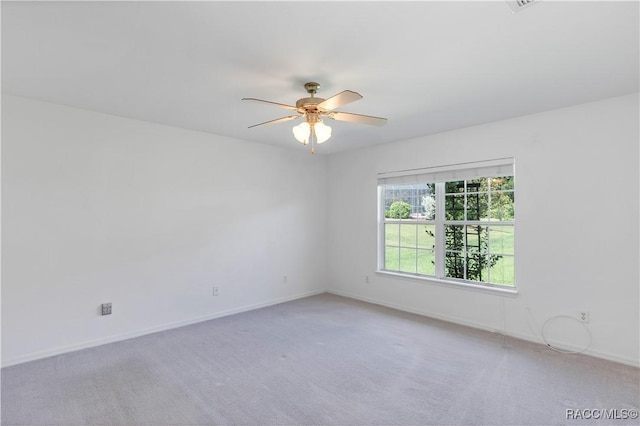 empty room featuring carpet and ceiling fan