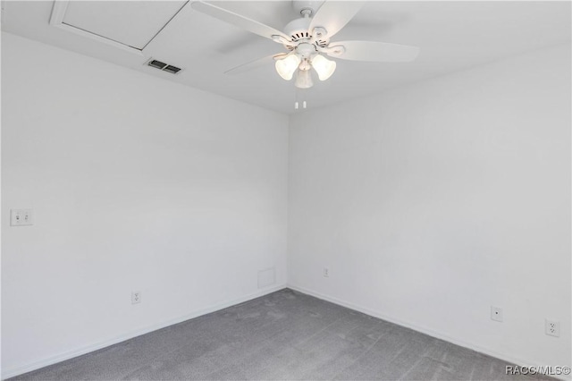 carpeted spare room featuring ceiling fan