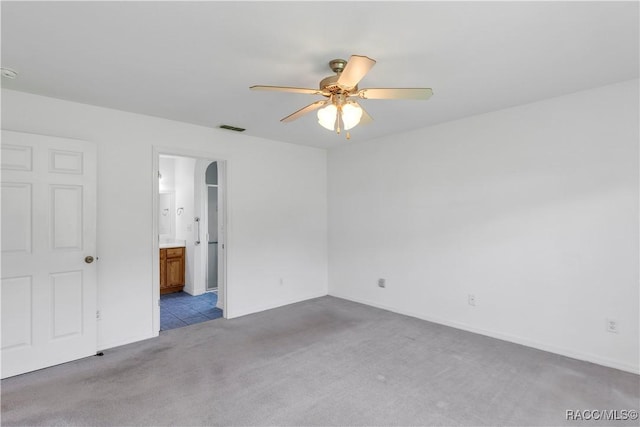 unfurnished room with ceiling fan and light colored carpet