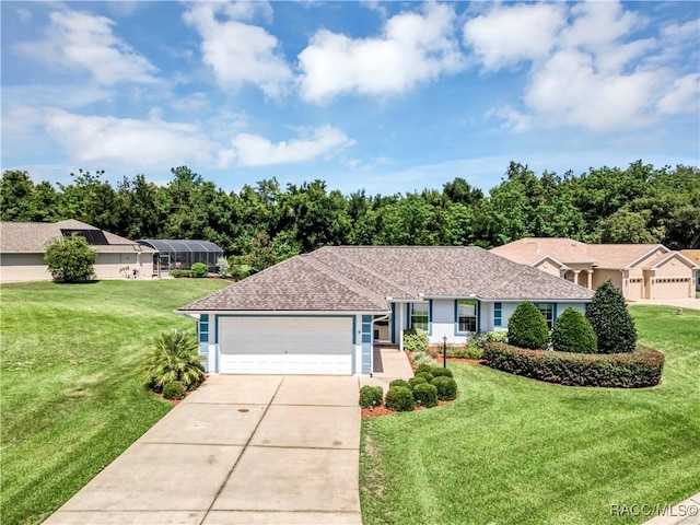 single story home featuring a garage and a front lawn