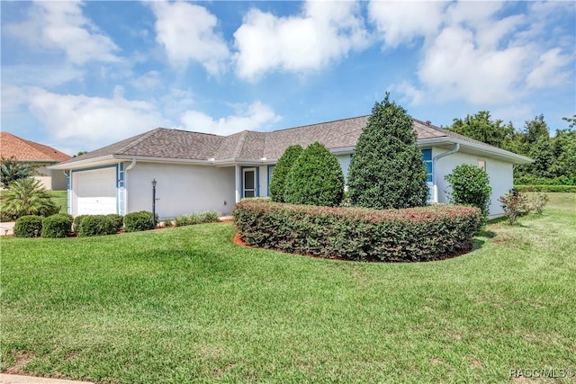 single story home with a garage and a front lawn