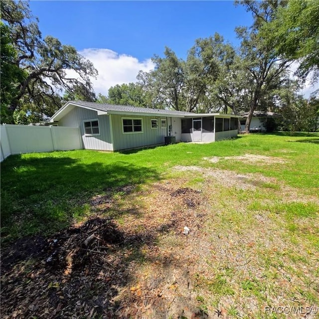 9227 N Fawn Way, Citrus Springs, FL 34434 - rear view of house with a sunroom