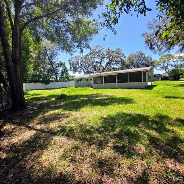 9227 N Fawn Way, Citrus Springs, FL 34434 - view of yard featuring a sunroom
