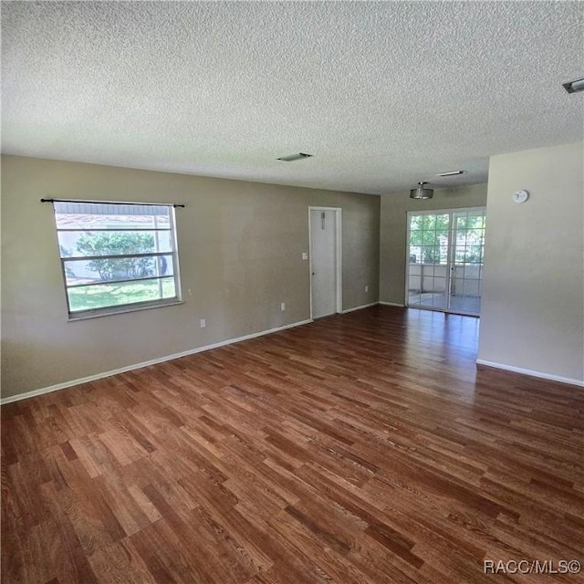 9227 N Fawn Way, Citrus Springs, FL 34434 - empty room featuring a textured ceiling and wood finished floors