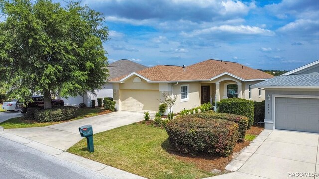 single story home with concrete driveway, a garage, stucco siding, and roof with shingles