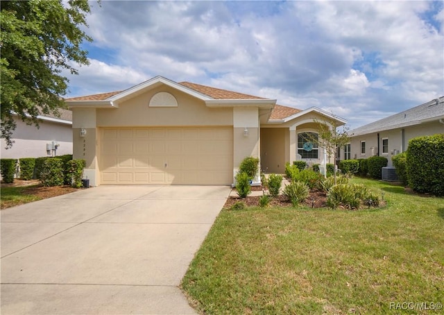 view of front of house with concrete driveway, a front yard, an attached garage, stucco siding, and central AC