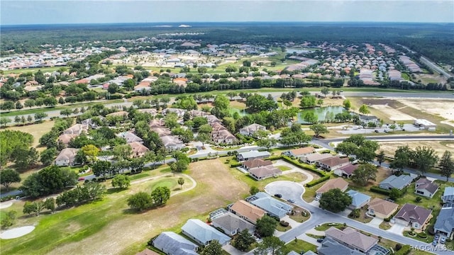 aerial view with a residential view and view of golf course