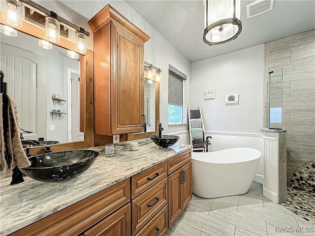 bathroom with plus walk in shower and vanity