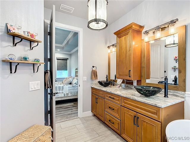 bathroom with vanity and wood-type flooring