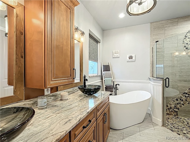 bathroom featuring plus walk in shower and vanity