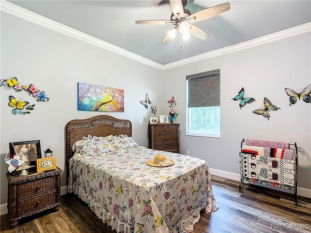 bedroom featuring ceiling fan, dark hardwood / wood-style flooring, and crown molding