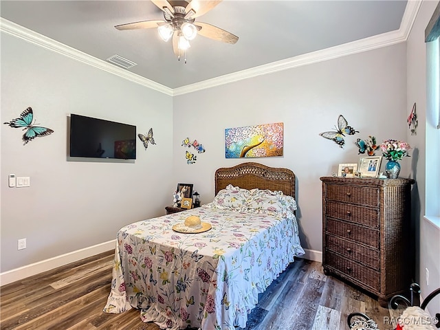 bedroom with ceiling fan, crown molding, and dark wood-type flooring