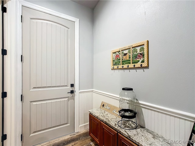 entryway with dark wood-type flooring