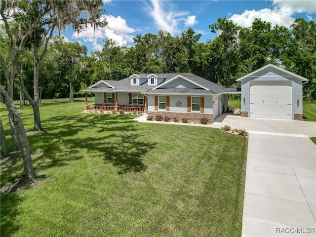 ranch-style house featuring a front yard, a porch, and a garage