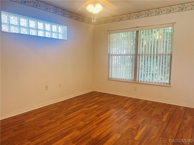 unfurnished room with ceiling fan and hardwood / wood-style flooring