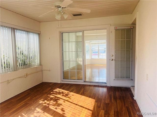 unfurnished sunroom featuring ceiling fan