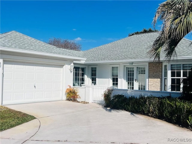 ranch-style home featuring a garage