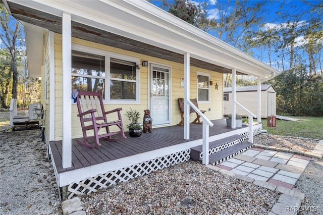 view of exterior entry featuring a porch