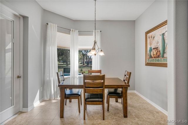 dining room featuring light tile patterned floors and baseboards