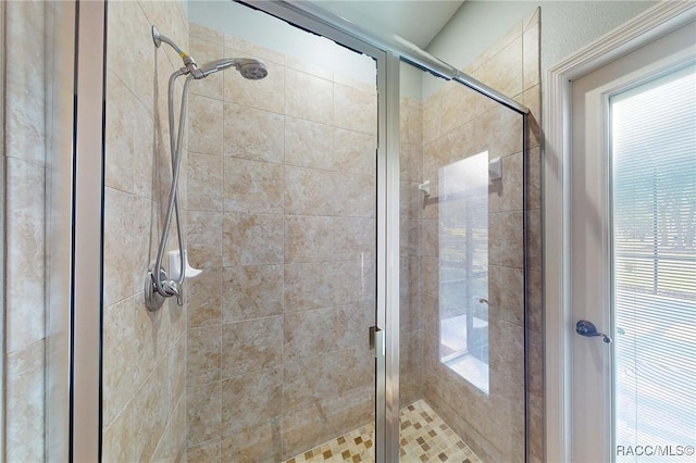 full bath with a healthy amount of sunlight and a stall shower