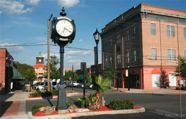 view of street with curbs, sidewalks, and street lights