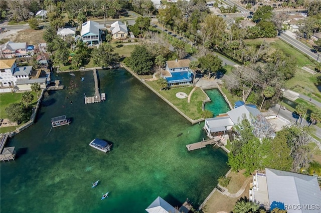 birds eye view of property with a water view and a residential view