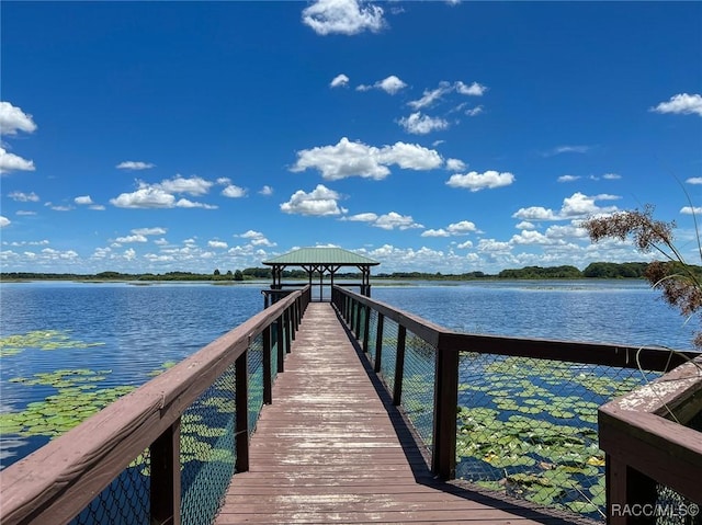 dock area with a gazebo and a water view