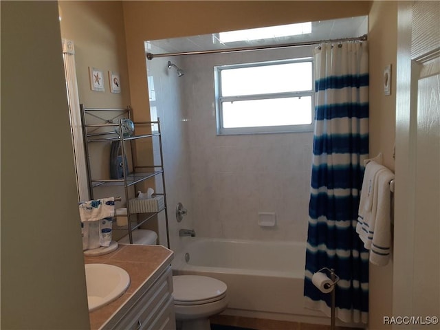 full bathroom featuring vanity, shower / bathtub combination with curtain, and toilet