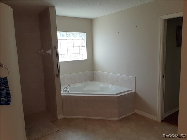 bathroom featuring plus walk in shower