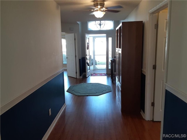 corridor featuring wood-type flooring