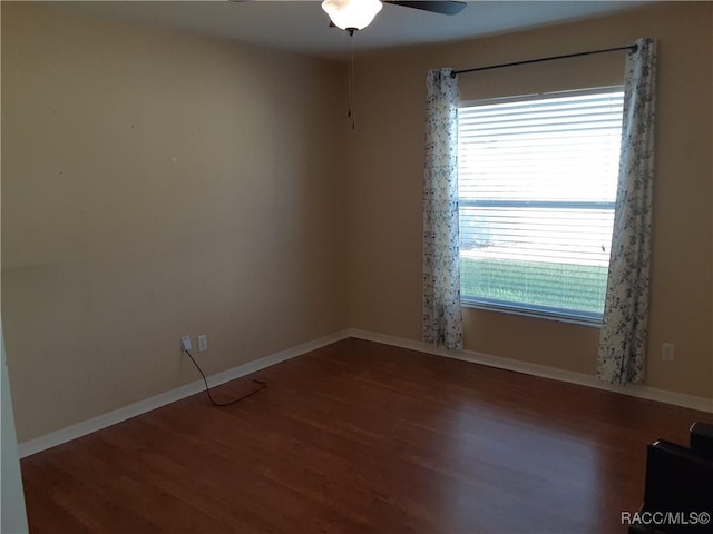 empty room with ceiling fan and wood-type flooring