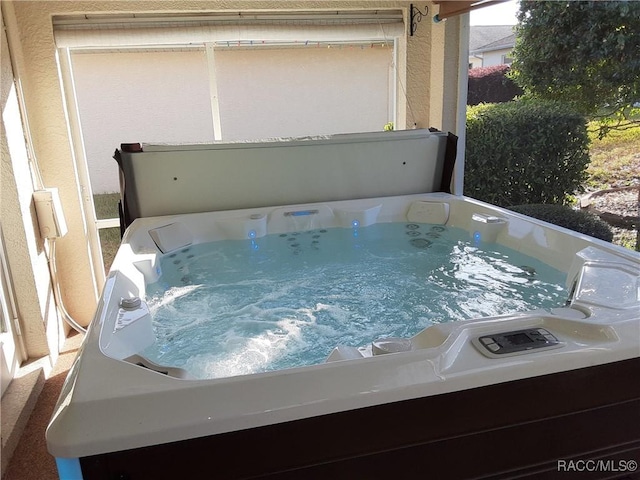 details with a jacuzzi and washer / dryer