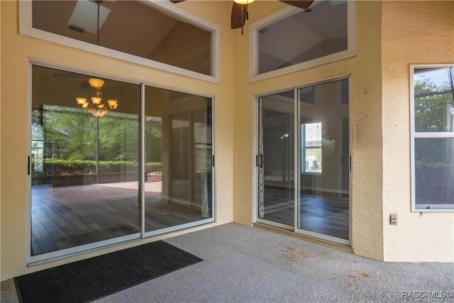 doorway to property with stucco siding