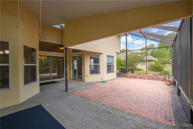 view of patio / terrace featuring a lanai and a ceiling fan
